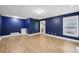 Living room with hardwood floors, fireplace, and access to the foyer at 4938 Cedar Lake Ter, Douglasville, GA 30135