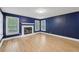 Cozy living room featuring a fireplace, hardwood floors, and natural light at 4938 Cedar Lake Ter, Douglasville, GA 30135