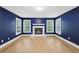 Inviting living room with fireplace, hardwood floors, and bright windows at 4938 Cedar Lake Ter, Douglasville, GA 30135
