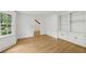 Office with hardwood floors, built-in shelving, and a window offering a view of the yard at 4938 Cedar Lake Ter, Douglasville, GA 30135