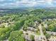 Scenic aerial view showcasing the neighborhood's lush tree coverage and the home's location among other residences at 1712 Grist Mill Dr, Marietta, GA 30062