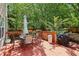 Back deck area with outside furniture and a grill, perfect for entertaining or enjoying the outdoors at 1712 Grist Mill Dr, Marietta, GA 30062
