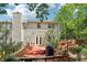 Back of house features a nice deck with string lights and chimney at 1712 Grist Mill Dr, Marietta, GA 30062