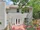 Home's rear showcasing deck, and fenced backyard, perfect for entertaining at 1712 Grist Mill Dr, Marietta, GA 30062
