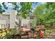 Back exterior featuring a large deck with string lights, access to the home, and a wood privacy fence at 1712 Grist Mill Dr, Marietta, GA 30062
