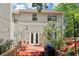 Back exterior featuring a deck with string lights, access to the home, and a gas grill at 1712 Grist Mill Dr, Marietta, GA 30062