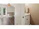 Hallway powder room features marble countertop, white cabinets, and designer fixtures at 1712 Grist Mill Dr, Marietta, GA 30062