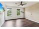 Bedroom featuring wood floors, ceiling fan, and a window for natural light at 1712 Grist Mill Dr, Marietta, GA 30062