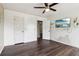 Bedroom boasts hardwood floors, ceiling fan, and walls ready for your personal touch at 1712 Grist Mill Dr, Marietta, GA 30062