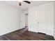 Bedroom with wood floors, white walls, and an open doorway to the rest of the house at 1712 Grist Mill Dr, Marietta, GA 30062