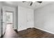 Bedroom with hardwood floors, ceiling fan, and an open doorway to other rooms at 1712 Grist Mill Dr, Marietta, GA 30062