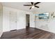 Bedroom with dark hardwood floors featuring white doors, baseboards, and trim at 1712 Grist Mill Dr, Marietta, GA 30062