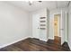 Bedroom with ceiling fan, hardwood flooring, and an access door to the adjacent bathroom at 1712 Grist Mill Dr, Marietta, GA 30062