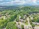 Aerial view of community highlighting lush surroundings and residential streetscape at 1712 Grist Mill Dr, Marietta, GA 30062