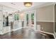 Bright dining area features hardwood floors and double doors leading to an outdoor deck at 1712 Grist Mill Dr, Marietta, GA 30062