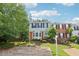 Charming two-story townhouse featuring a bay window, brick accents, and a well-manicured front yard at 1712 Grist Mill Dr, Marietta, GA 30062