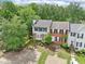 Charming two-story home with manicured front yard and brick facade, nestled among lush greenery and mature trees at 1712 Grist Mill Dr, Marietta, GA 30062