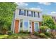 Inviting front exterior with beautiful brick accents and a well-maintained landscape, offering curb appeal and charm at 1712 Grist Mill Dr, Marietta, GA 30062