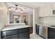 Well-lit kitchen with modern stainless steel appliances and granite countertops at 1712 Grist Mill Dr, Marietta, GA 30062