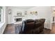 Bright living room with a white marble fireplace, dark wood floors, and a comfortable reclining sofa at 1712 Grist Mill Dr, Marietta, GA 30062