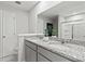Modern bathroom features double sinks with granite countertops, framed mirrors, and a separate shower at 2010 Moonlight Path, Covington, GA 30016