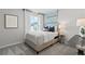 Inviting bedroom with a comfortable bed, soft textures, and a view to the outside at 2010 Moonlight Path, Covington, GA 30016
