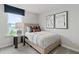 Cozy bedroom with a comfortable bed, stylish decor, and ample natural light at 2010 Moonlight Path, Covington, GA 30016