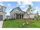 Attractive home with a well-kept lawn and mulch flower beds on a sunny day at 2010 Moonlight Path, Covington, GA 30016