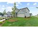 Beautiful exterior of a two-story home with a well-manicured lawn and paved pathway at 2010 Moonlight Path, Covington, GA 30016