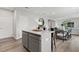 Well-designed kitchen with a center island, modern appliances, and easy access to the dining area at 2010 Moonlight Path, Covington, GA 30016