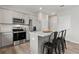 Beautiful kitchen with stainless steel appliances, granite countertops, and a stylish island with seating at 2010 Moonlight Path, Covington, GA 30016