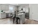 Modern kitchen with gray cabinets, stainless steel appliances, and a center island at 2010 Moonlight Path, Covington, GA 30016