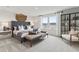 Spacious main bedroom featuring a large bed, seating area, and a modern display cabinet at 2010 Moonlight Path, Covington, GA 30016