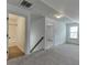 An attic with carpeting that connects to a bathroom and a bedroom at 2906 Jones Phillips Rd, Dacula, GA 30019