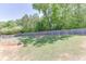 Picturesque backyard with a wooden deck and lush green lawn, offering a serene and private outdoor space at 2906 Jones Phillips Rd, Dacula, GA 30019