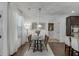 Cozy dining area with natural light, classic decor, and wood flooring at 2906 Jones Phillips Rd, Dacula, GA 30019