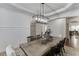 Bright dining area with open layout, stylish lighting, and convenient access to the kitchen at 2906 Jones Phillips Rd, Dacula, GA 30019