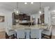 Modern kitchen with granite countertops, stainless steel appliances, and bar seating at 2906 Jones Phillips Rd, Dacula, GA 30019