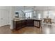 Kitchen featuring an island, dark cabinets, stainless steel appliances, and hardwood floors at 2906 Jones Phillips Rd, Dacula, GA 30019