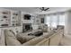Bright living room with custom built-ins surrounding a stone fireplace at 2906 Jones Phillips Rd, Dacula, GA 30019