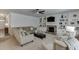 Spacious living room with fireplace, built-in shelves, and plush seating arrangement at 2906 Jones Phillips Rd, Dacula, GA 30019