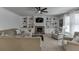 Cozy living room with built-in shelving, stone fireplace, and neutral color palette at 2906 Jones Phillips Rd, Dacula, GA 30019
