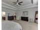 Spacious main bedroom with tray ceiling, ceiling fan and an ensuite bathroom at 2906 Jones Phillips Rd, Dacula, GA 30019