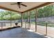 Screened-in porch with outdoor ceiling fan provides relaxing views of the backyard at 2906 Jones Phillips Rd, Dacula, GA 30019