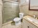 Bathroom has a vanity sink, toilet, and shower with a glass door at 3479 Woodruff Ridge Ln, Loganville, GA 30052