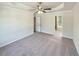 Spacious main bedroom features plush carpeting, a ceiling fan, and a private ensuite bathroom at 3479 Woodruff Ridge Ln, Loganville, GA 30052
