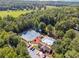 Stunning aerial view of community amenities, including tennis courts, pool, clubhouse, and parking at 3725 Falls Trl, Winston, GA 30187
