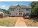 Expansive backyard featuring a wooden deck, patio, and lush greenery at 3725 Falls Trl, Winston, GA 30187