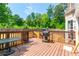 Backyard deck area with a grill and outdoor furniture, perfect for entertaining guests at 3725 Falls Trl, Winston, GA 30187
