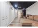 Cozy basement featuring a sectional couch and storage space at 3725 Falls Trl, Winston, GA 30187